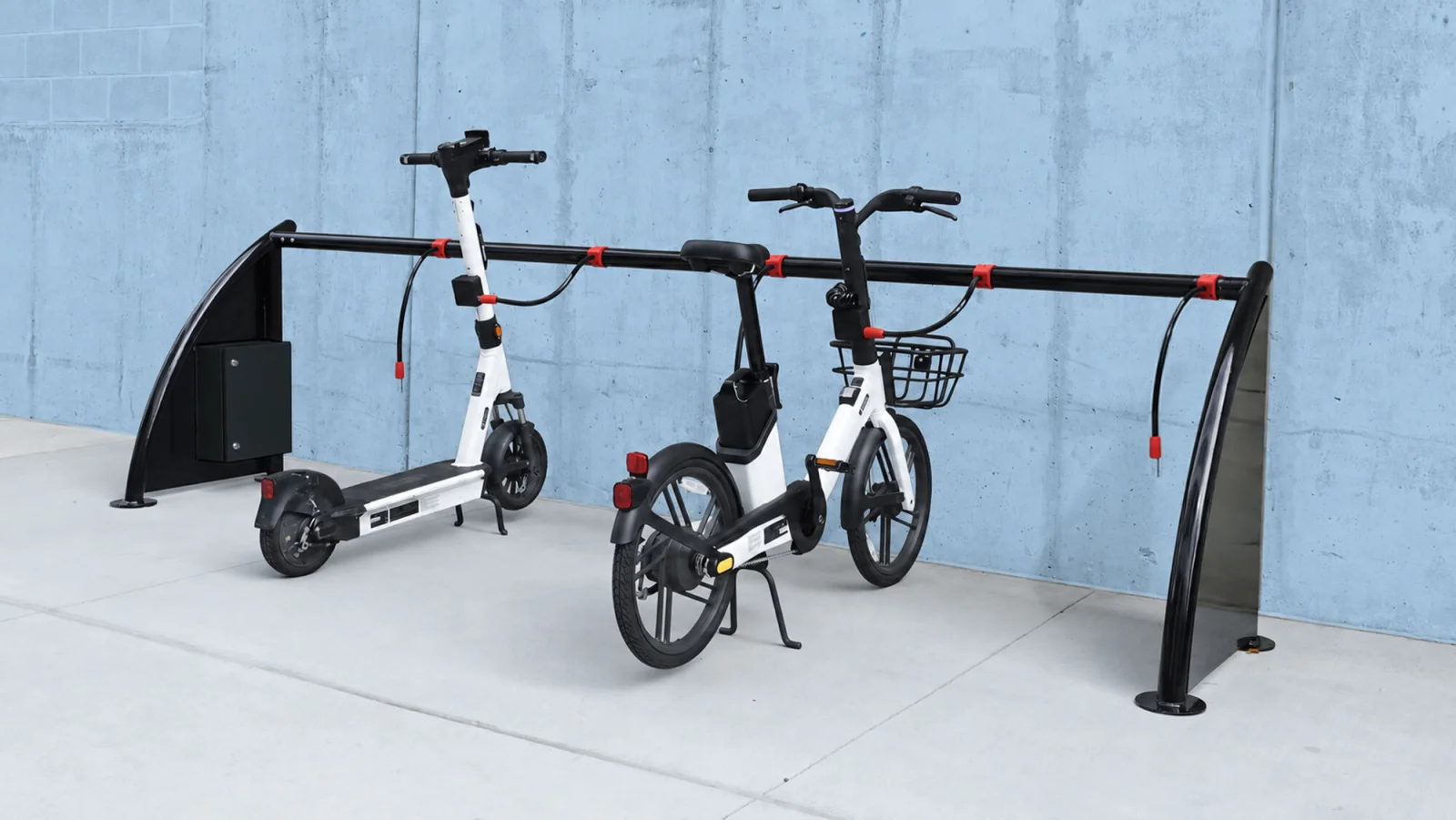 An e-bike and scooter docked at a ChargeLock station.