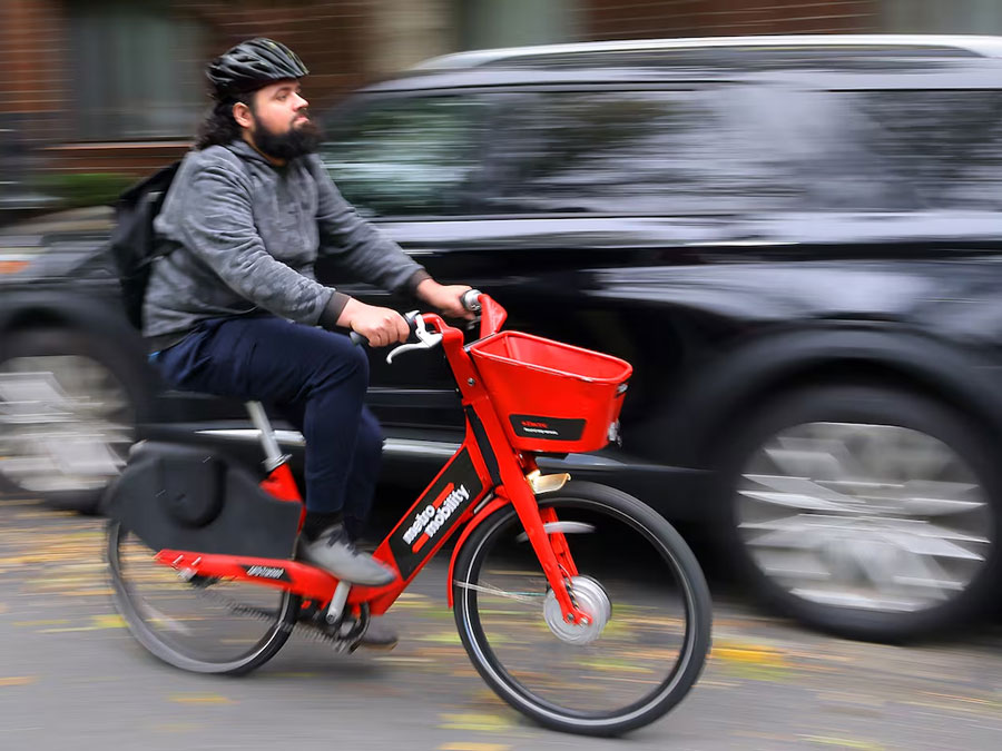 Man commuting on Metro Mobility e-bike